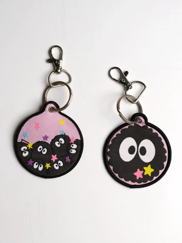 Dust-bunnies-Keychain-2_comicsense.webp Dust Bunnies Woven Keychain